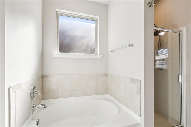 bathroom with shower with separate bathtub