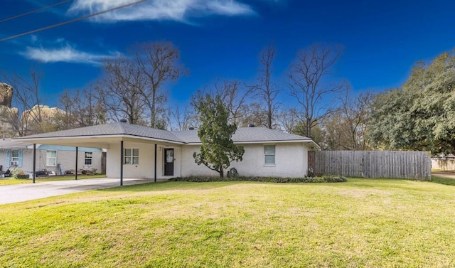 ranch-style house with a front lawn and a carport