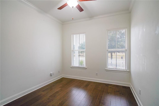 empty room featuring dark hardwood / wood-style flooring, crown molding, and ceiling fan