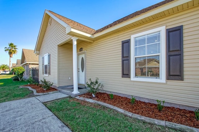 doorway to property featuring a yard