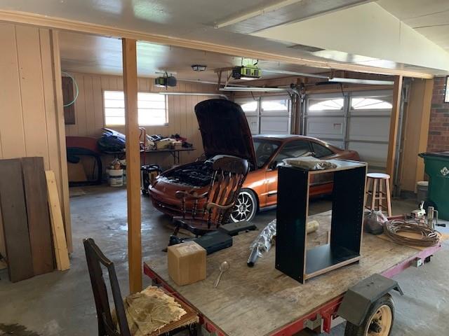 garage featuring wooden walls