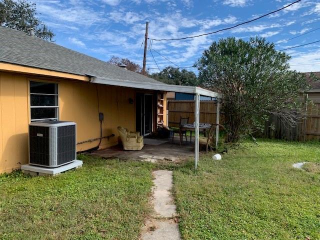 view of yard with a patio and central AC