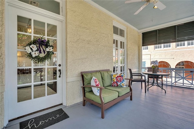 exterior space with a porch and ceiling fan