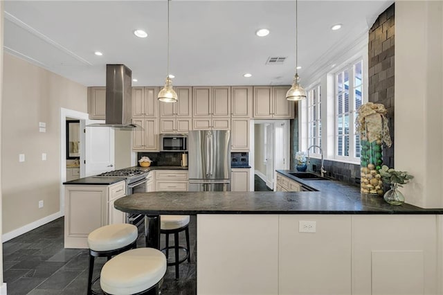 kitchen with visible vents, appliances with stainless steel finishes, a sink, island exhaust hood, and backsplash