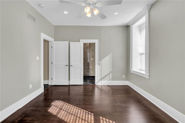 unfurnished bedroom featuring recessed lighting, wood finished floors, a ceiling fan, visible vents, and baseboards