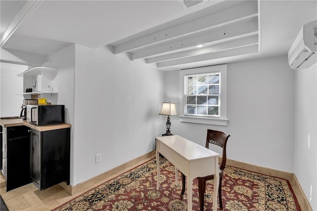 office space featuring a wall unit AC, baseboards, and beam ceiling