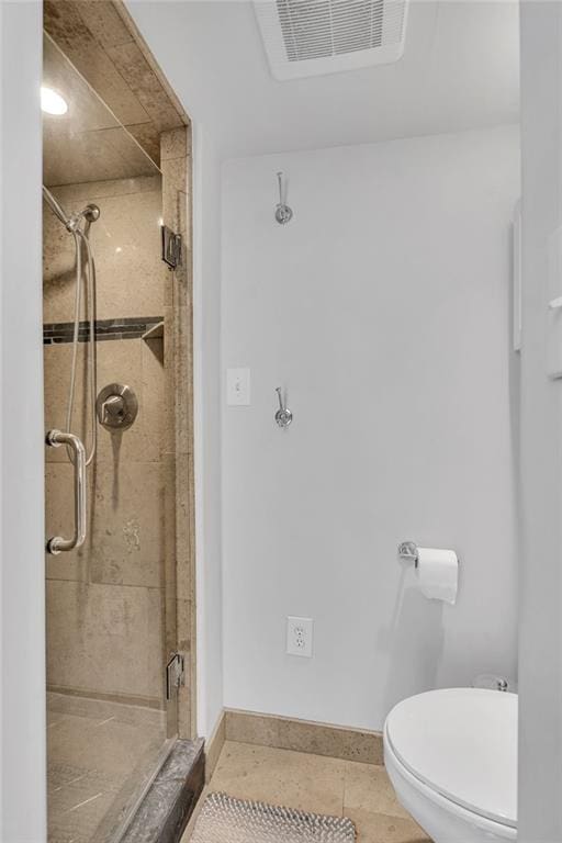 full bath featuring a stall shower, visible vents, toilet, and tile patterned floors