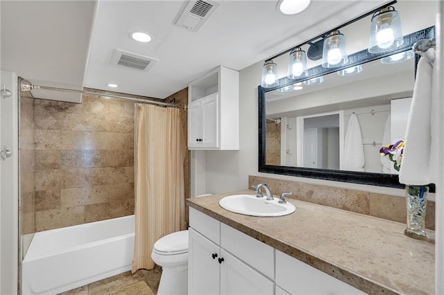 bathroom featuring toilet, visible vents, shower / tub combo with curtain, and vanity