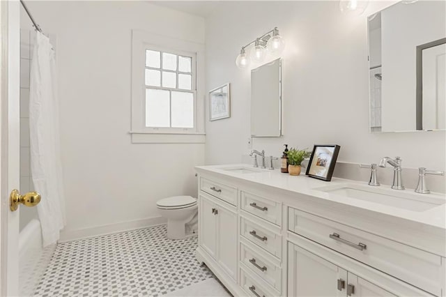 full bathroom featuring vanity, shower / tub combo, and toilet