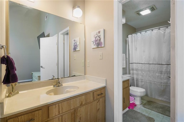 bathroom featuring walk in shower, vanity, and toilet