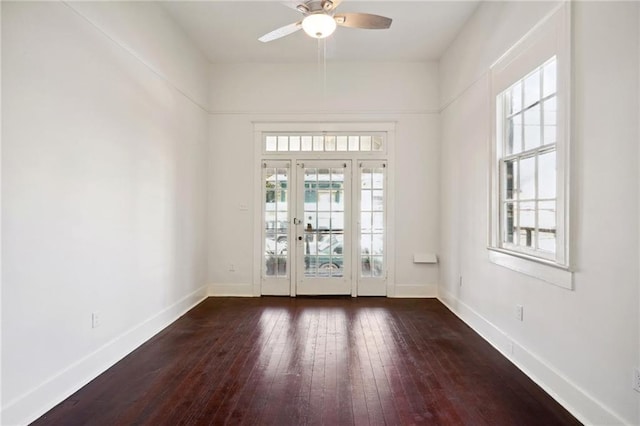 entryway with ceiling fan, plenty of natural light, and dark wood-type flooring