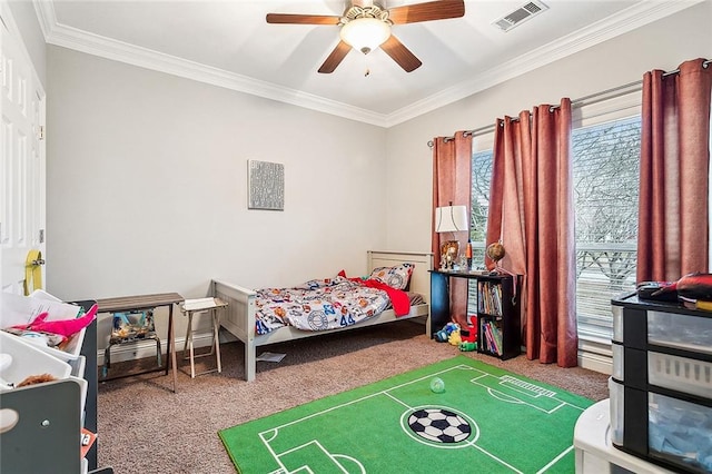 carpeted bedroom featuring ceiling fan and crown molding