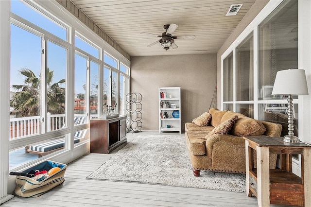 sunroom / solarium with ceiling fan