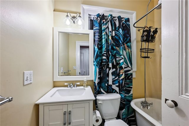 full bathroom with toilet, vanity, and shower / bathtub combination