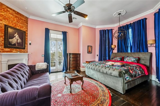 bedroom with hardwood / wood-style flooring, ceiling fan, access to exterior, and ornamental molding