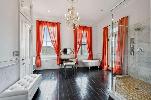 living area featuring ornamental molding, a chandelier, and hardwood / wood-style flooring