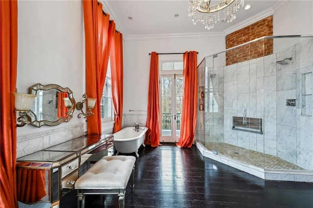 bathroom featuring ornamental molding, hardwood / wood-style floors, an inviting chandelier, and plus walk in shower