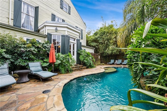 view of swimming pool with a patio area