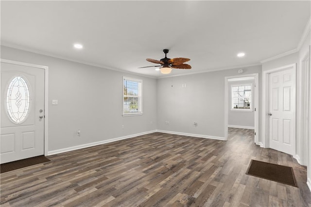 entryway featuring ceiling fan, dark wood-type flooring, and crown molding