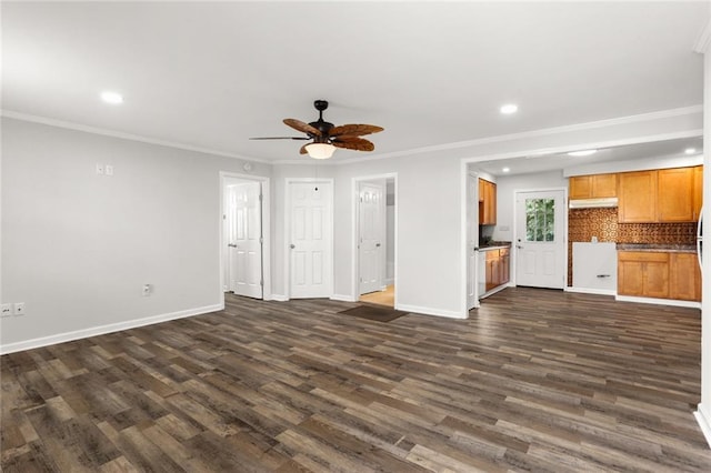 unfurnished living room featuring ornamental molding, dark hardwood / wood-style flooring, and ceiling fan