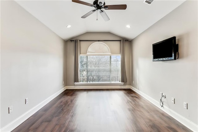 unfurnished room featuring dark hardwood / wood-style floors, ceiling fan, and vaulted ceiling