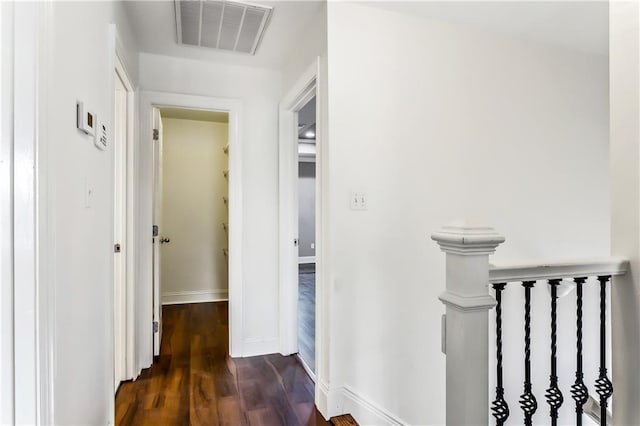 hallway featuring dark hardwood / wood-style flooring