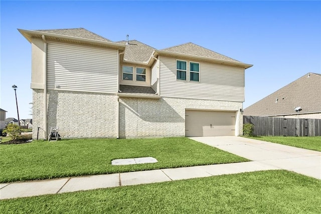 view of front of home with a front lawn and a garage