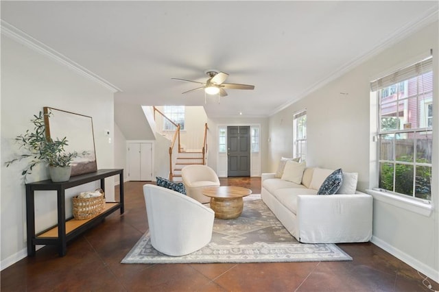 tiled living room featuring ceiling fan and crown molding