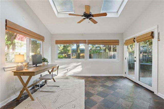 unfurnished sunroom with lofted ceiling with skylight and ceiling fan