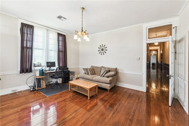 living room with dark hardwood / wood-style flooring, a chandelier, and crown molding