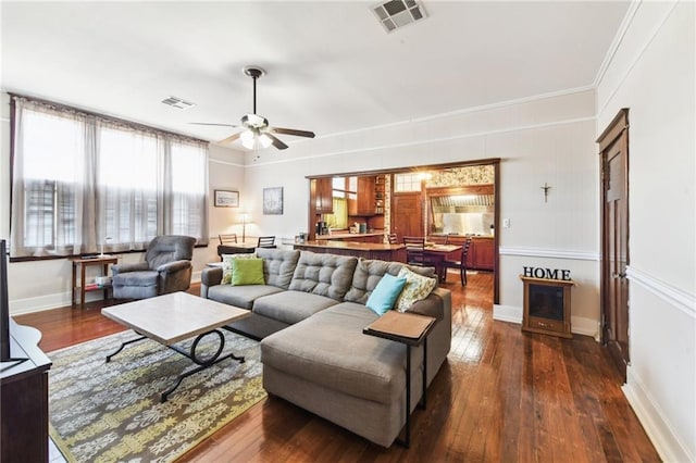 living room with ceiling fan and dark hardwood / wood-style floors