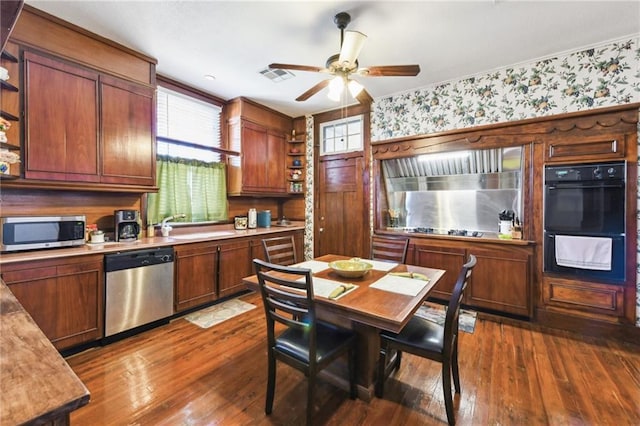 kitchen with sink, ceiling fan, hardwood / wood-style floors, and black appliances