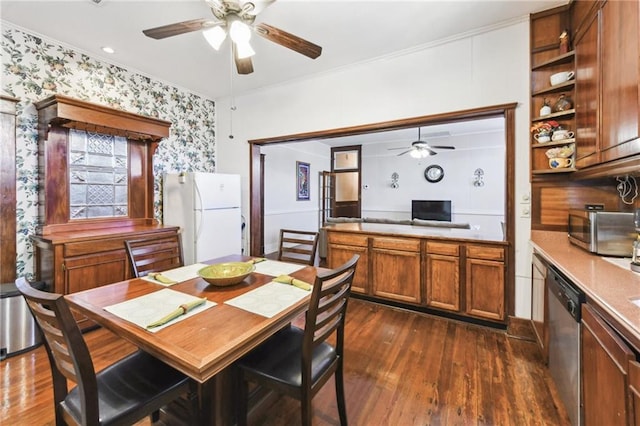 dining area featuring crown molding and dark hardwood / wood-style floors