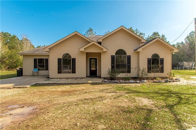 ranch-style home featuring a patio area and a front lawn