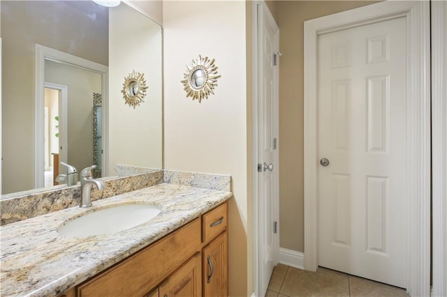 bathroom featuring tile patterned flooring and vanity