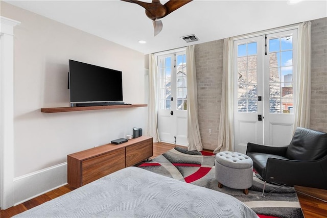 bedroom with hardwood / wood-style floors and ceiling fan