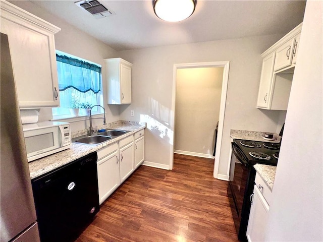 kitchen with sink, white cabinets, black appliances, and dark hardwood / wood-style floors