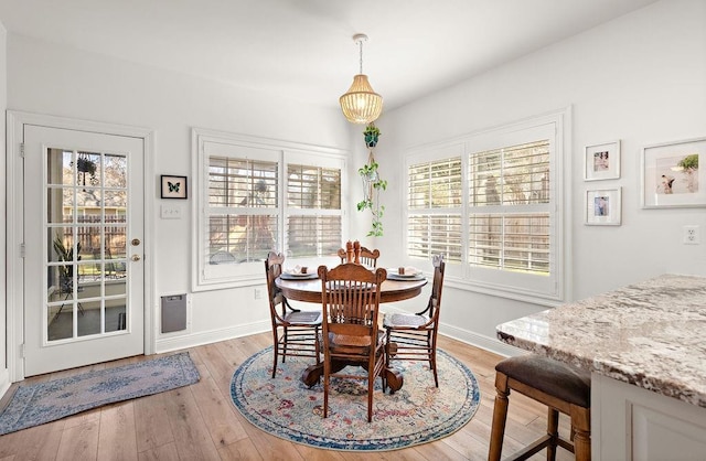 dining space with light wood-type flooring