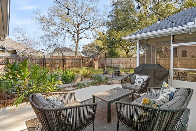 view of patio featuring an outdoor living space, ceiling fan, a grill, and a sunroom