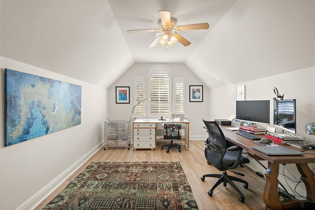 office area featuring light wood-type flooring, vaulted ceiling, and ceiling fan