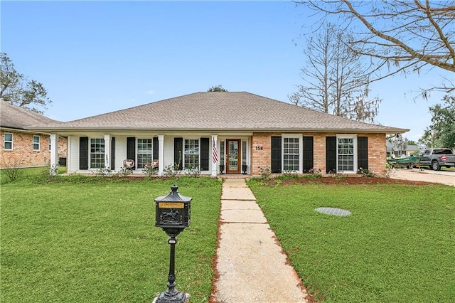 ranch-style home with a front lawn