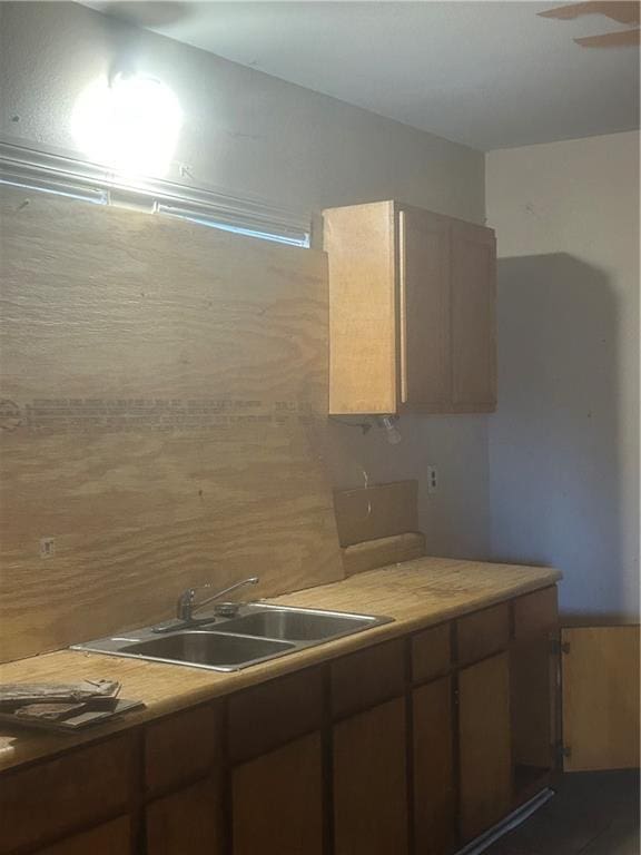 kitchen with ceiling fan and sink