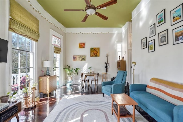 sitting room featuring ceiling fan and hardwood / wood-style flooring