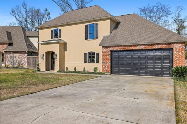 view of front property featuring a garage and a front lawn