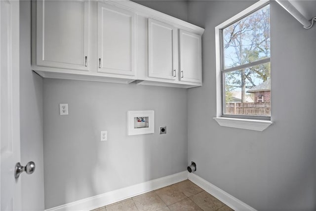 clothes washing area featuring washer hookup, electric dryer hookup, cabinets, and light tile patterned floors