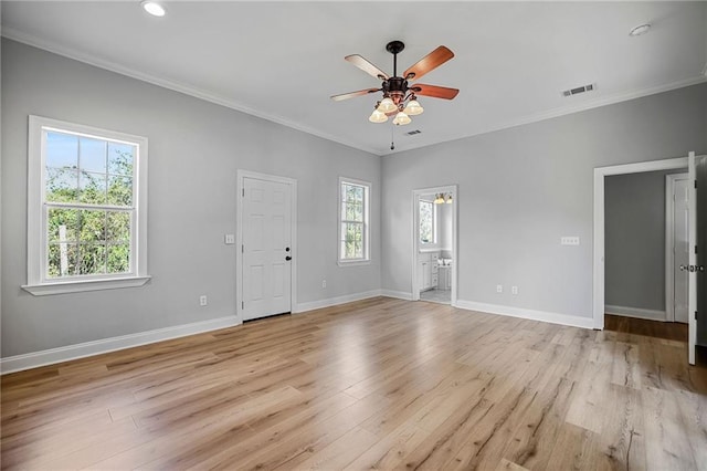 empty room featuring ceiling fan, light hardwood / wood-style flooring, and crown molding