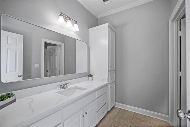 bathroom with crown molding, tile patterned flooring, and vanity