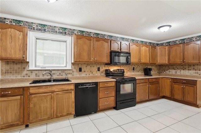 kitchen with black appliances, decorative backsplash, ornamental molding, and sink