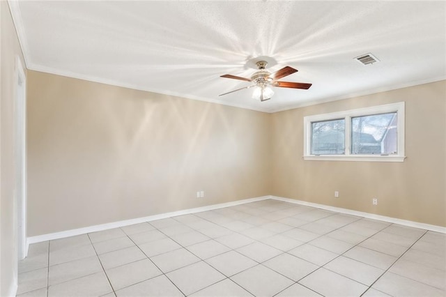 tiled spare room with ceiling fan and ornamental molding