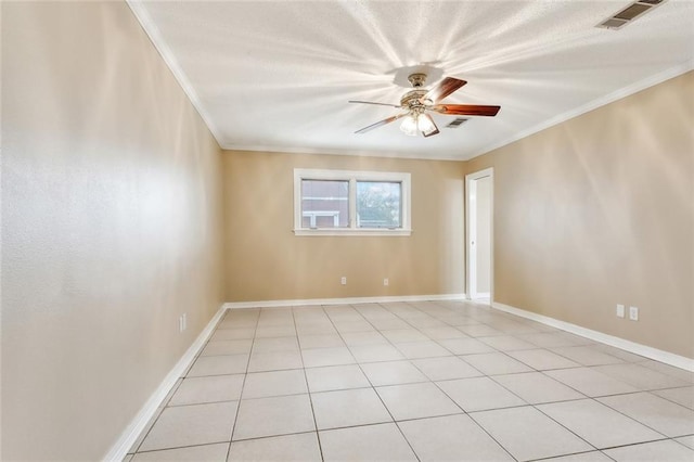 tiled spare room featuring crown molding and ceiling fan